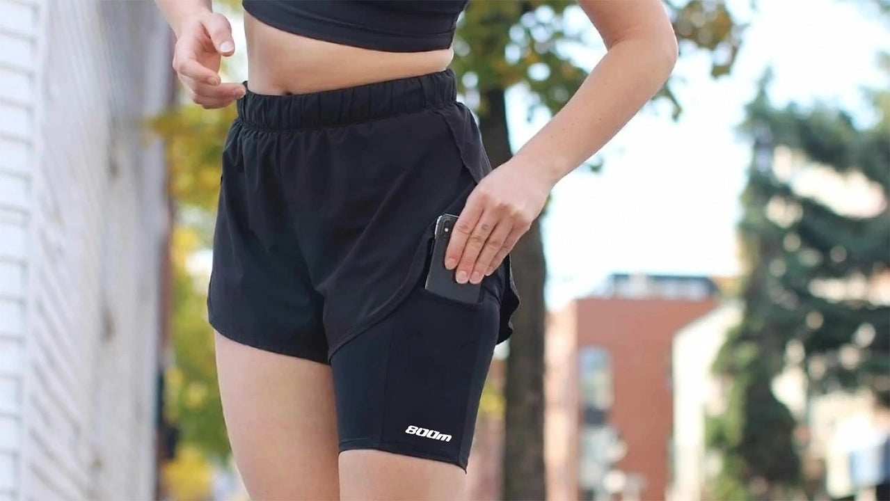 A hero shot of a woman inserting a phone into the legband sold by 800m.