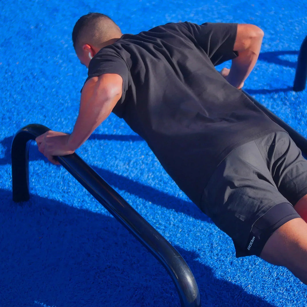 Runner doing dynamic warm-up stretches outdoors before a long run