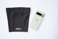 Back view of the black 800m THIGHBAND running phone holder with a Google Pixel in its pocket.